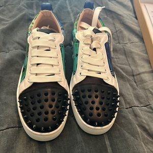 Brand new. Never worn Christian Louboutin Tennis shoes. Certificate included